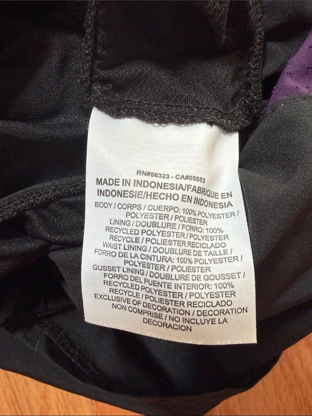 Nike Women's Black Athletic Shorts with Purple Side Panels